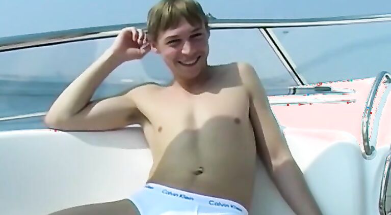 Blond British twink Timmy B does an interview and jerks off
