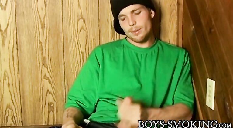 Perverted guy wanks off cock while chainsmoking