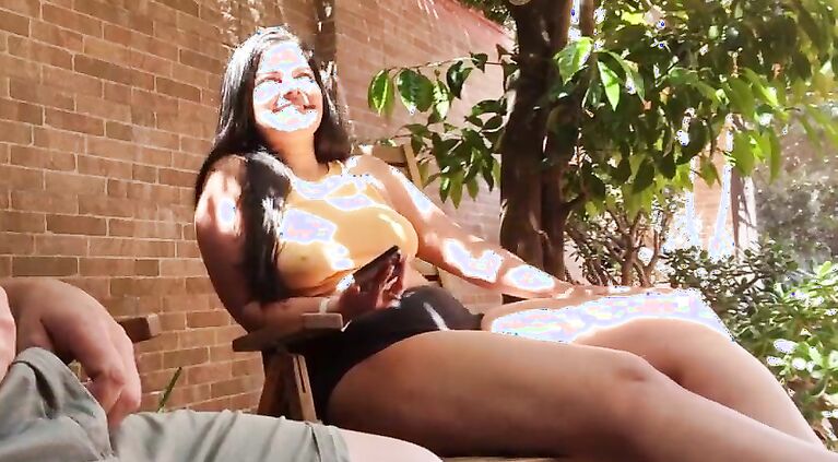 My stepson takes out his big cock in the garden, he gets turned on watching me and showing his boner to the neighbors. My nipples are very hard and I am not wearing a bra