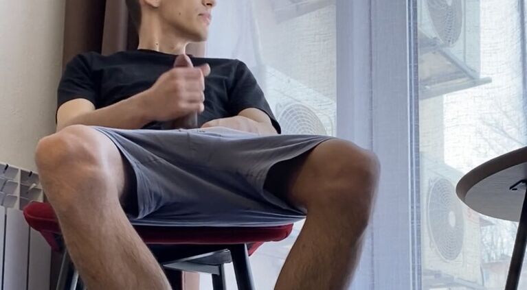 A GUY WITH HAIRY LEGS IN WHITE SOCKS ADIDAS JERKS OFF A DICK